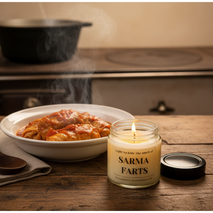 Sarma Candle with Cabbage Rolls on Rustic Table
