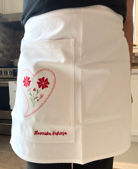 Handmade embroidered half apron from Slovenska Kuhinja, 100% cotton, crafted in Slovenia for kitchen use, cooking, baking, and entertaining.